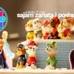 Vizual za Sajam zanatstva i poslastica na kojem se nalaze figurice za torte napravljene za torte.